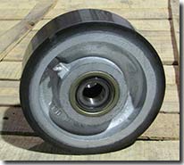 Rubber on iron core snow plow wheel